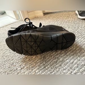 Nike running shoes are black very lightweight